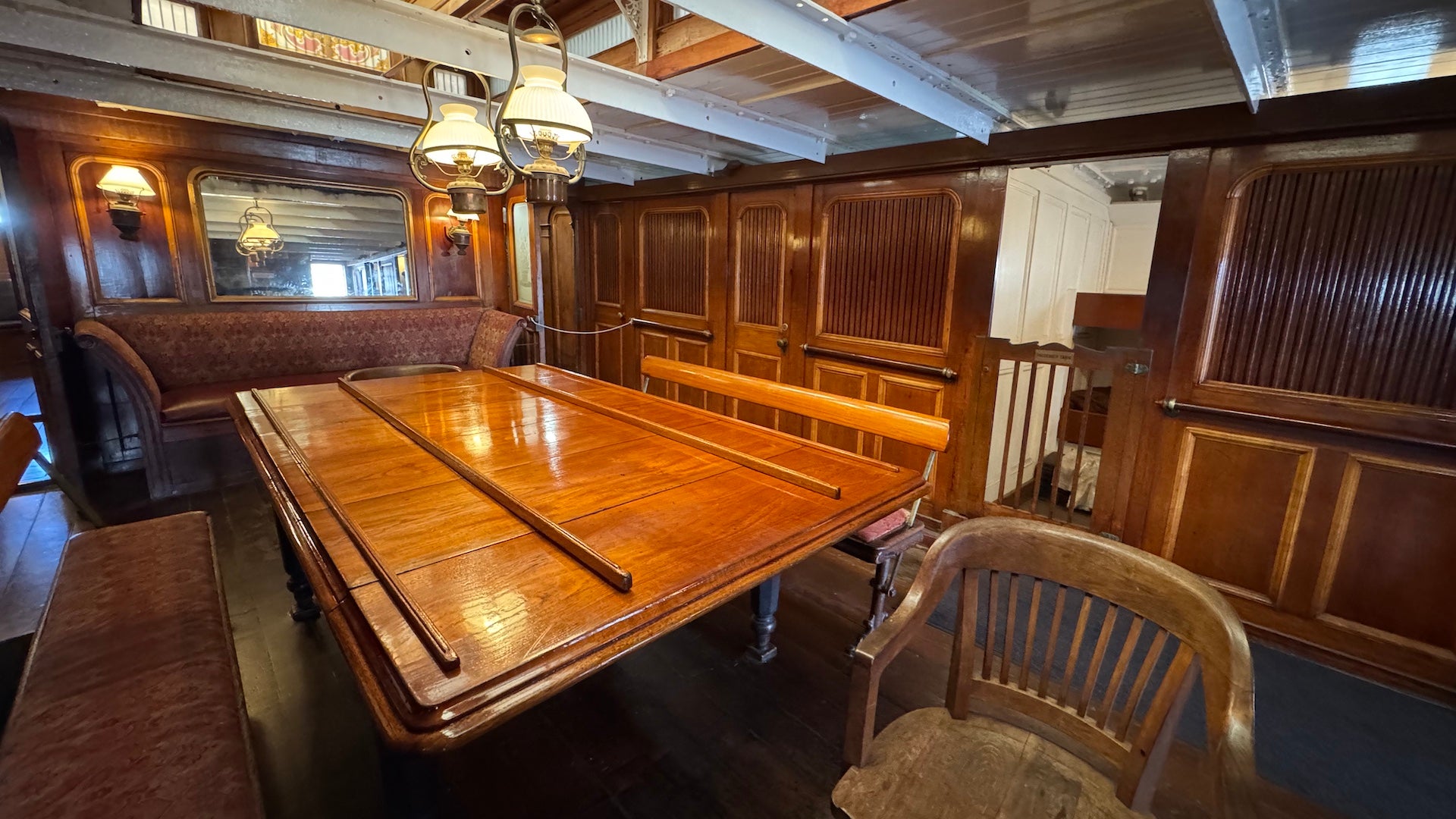 Interior wood walls and wooden table aboard the Star of India ship